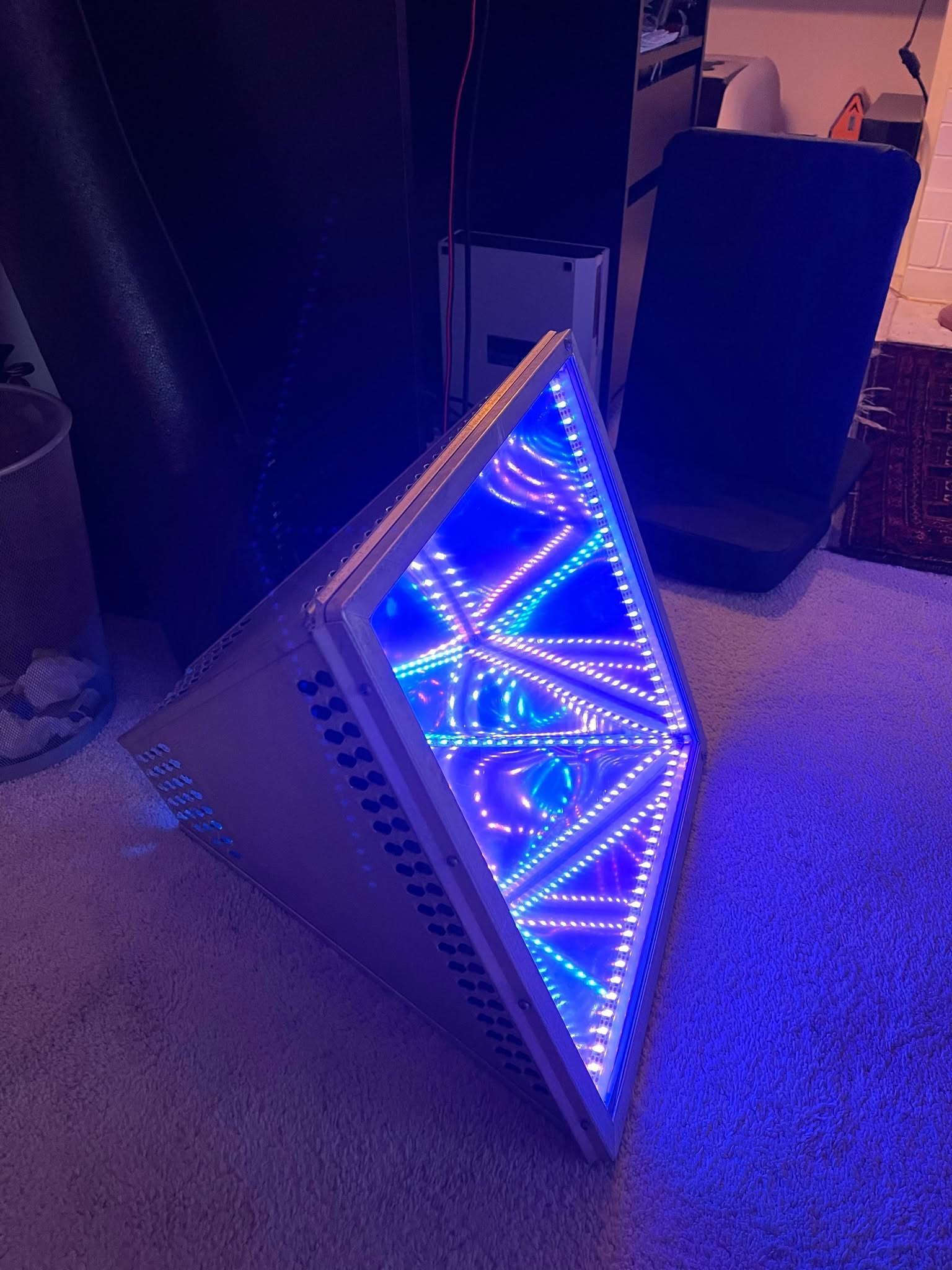 My illuminated infinity-mirror hobby prototype, with blue and multicoloured LED reflections, photographed in 2021
